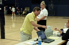 Calling out volleyball statistics during a George Fox contest.